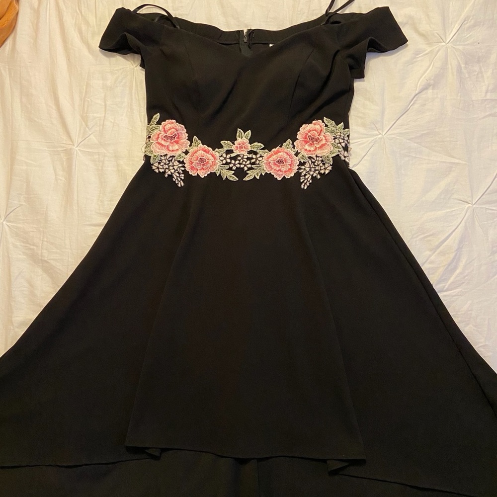 Off the shoulder, high and low black dress.